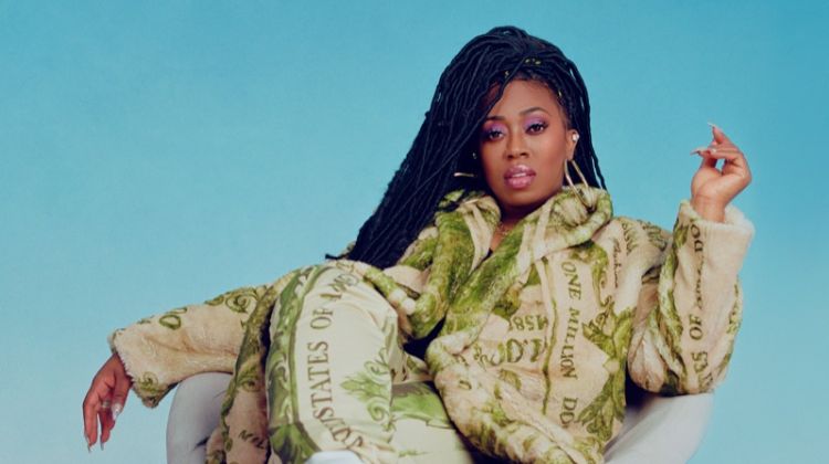 Rapper Missy Elliott poses in Moschino jacket and pants with Chloe sneakers