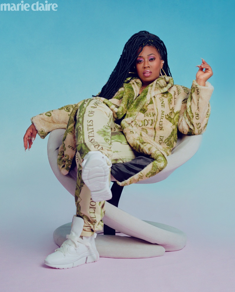 Rapper Missy Elliott poses in Moschino jacket and pants with Chloe sneakers