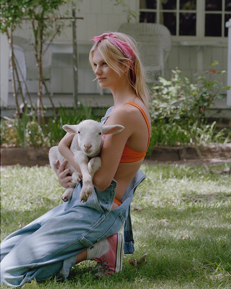 Posing with a goat, Nadine Leopold wears a look from Bamba Swim