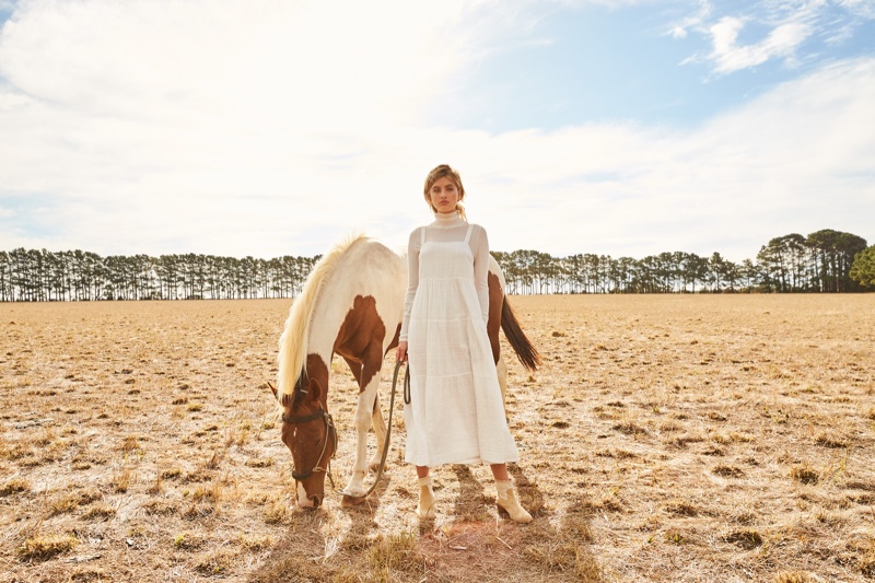 Posing with a horse, Megan Irwin appears in Rowie The Label pre-spring 2019 campaign