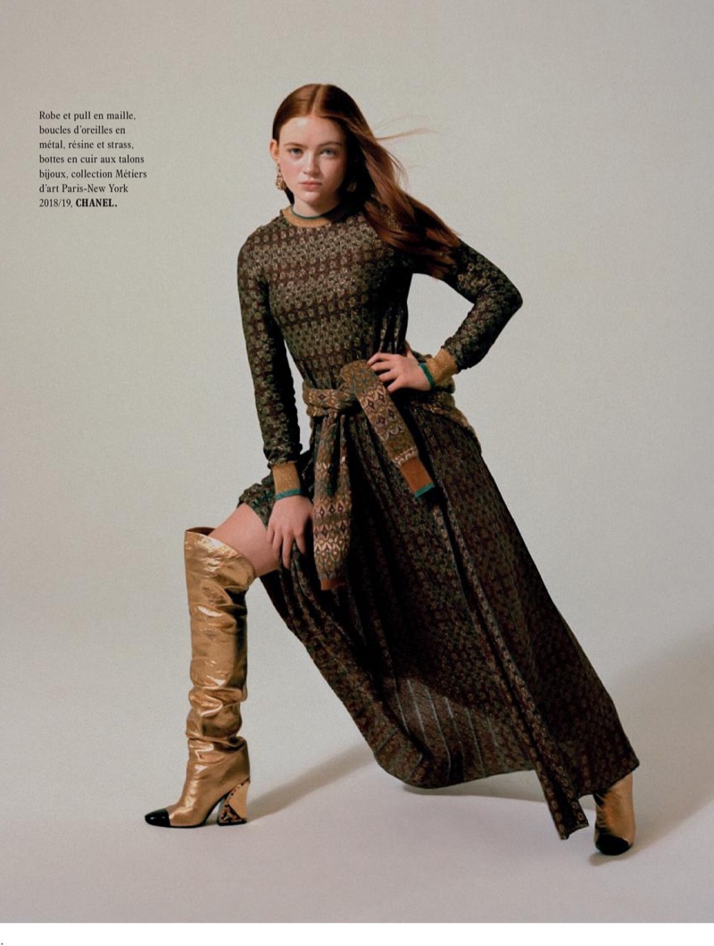 Striking a pose, Sadie Sink wears Chanel dress, sweater and boots