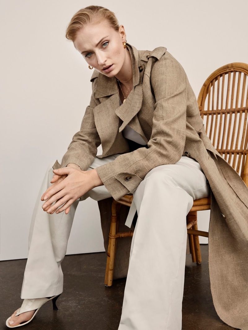 Actress Sophie Turner poses in Bottega Veneta coat, ATM Anthony Thomas Melillo tank, Off-White pants and Staud sandals