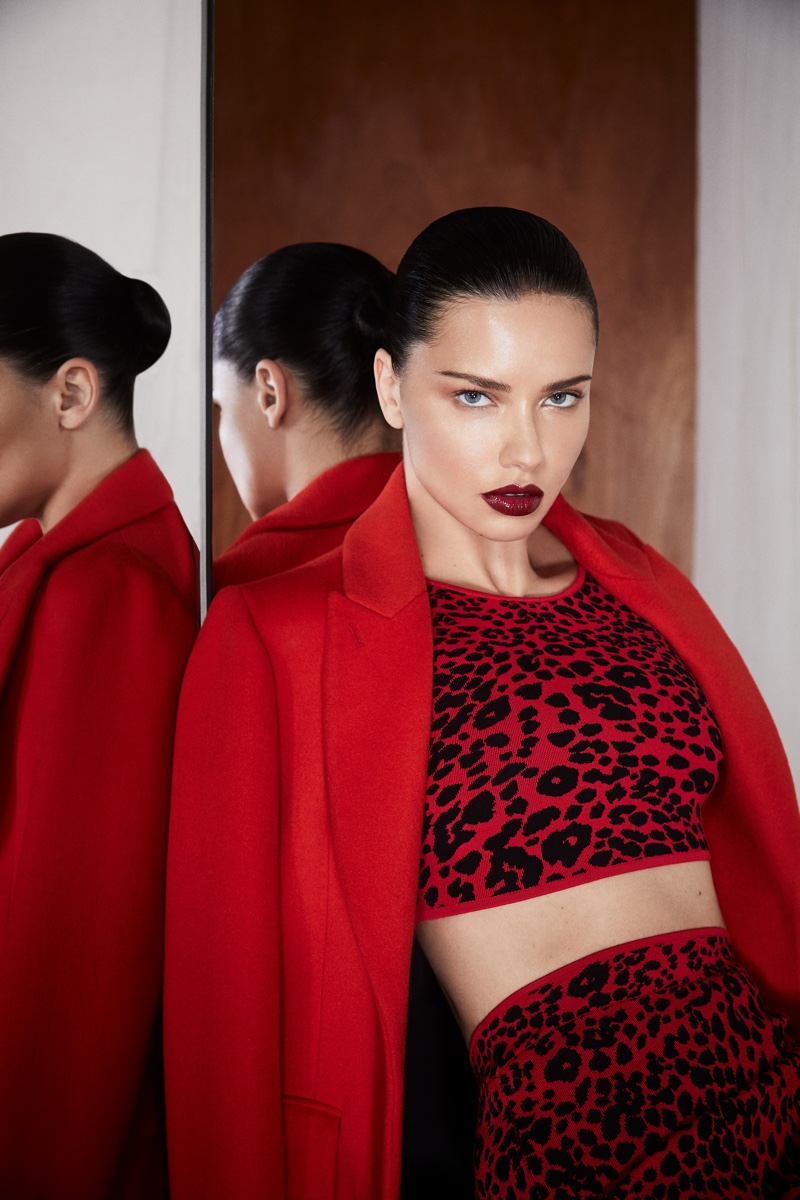 Wearing red, Adriana Lima appears in BCBGMAXAZRIA fall-winter 2019 campaign