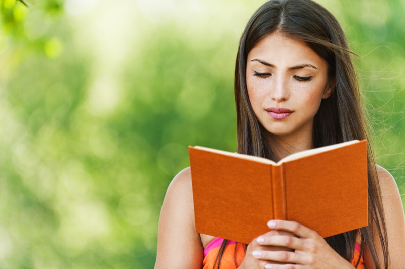 Beautiful Brunette Woman Reading Book