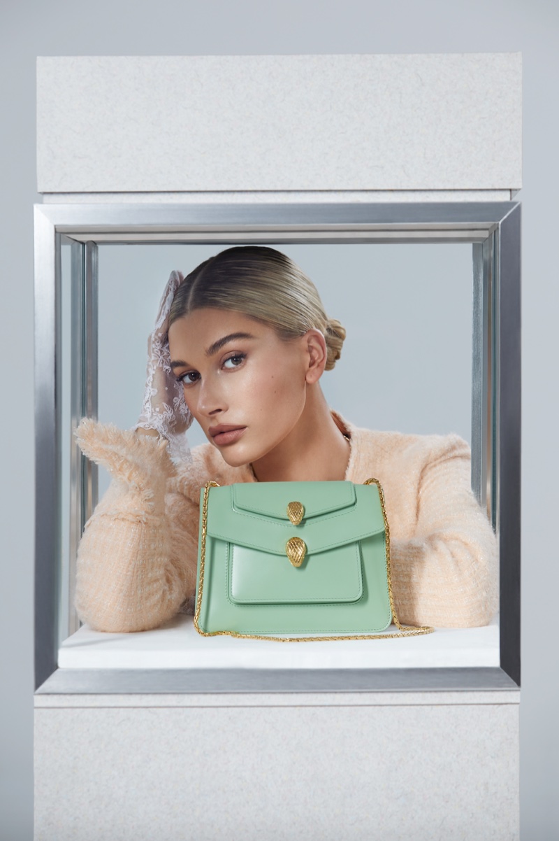 Model Hailey Baldwin poses with Serpenti Forever bag for Alexander Wang x Bulgari campaign