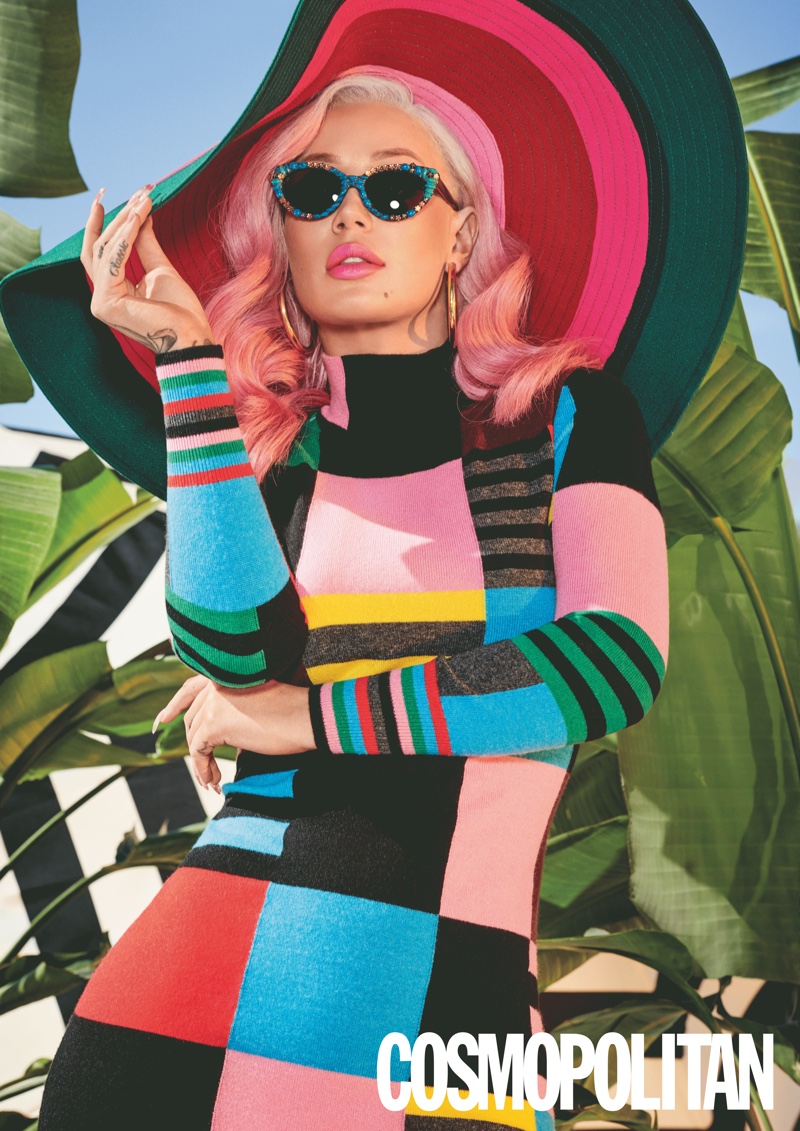 Iggy Azalea poses in Chinti & Parker dress, Marimekko hat, Mercura NYC sunglasses and Jennifer Fisher earrings