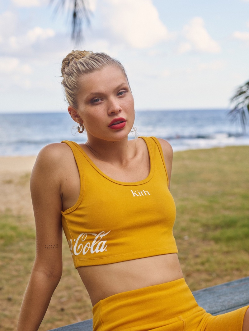 Wearing activewear, Josie Canseco poses in Kith x Coca-Cola Season 4 campaign