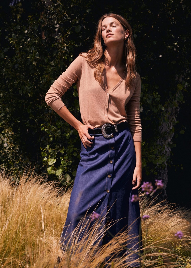 Keeping it casual, Mathilde Brandi wears Mango cardigan and denim skirt