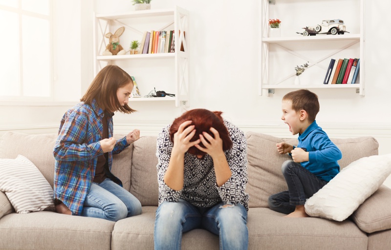 Mother Stressed Couch Fighting Kids Children