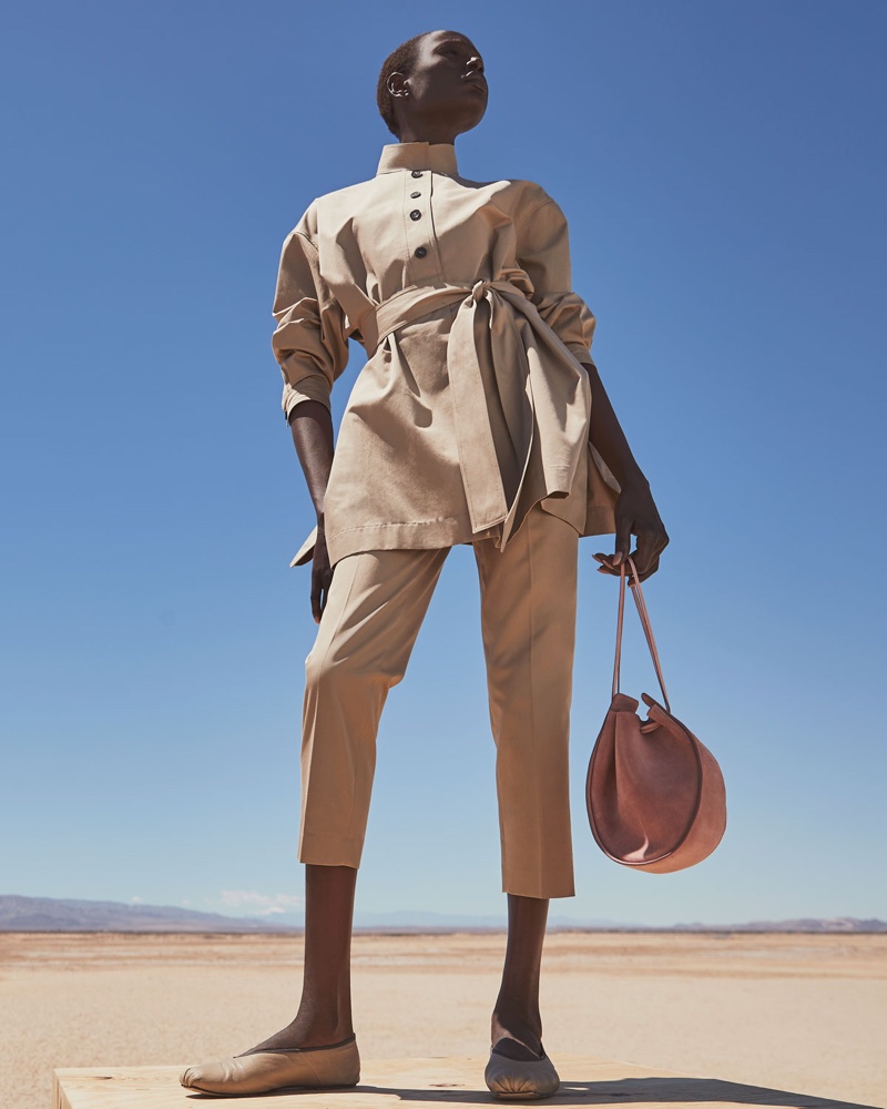 The Row Big Varo Tunic Shirt $2,050, Clark Cotton Slim-Leg Ankle Pants $1,020, Canvas Ballet Flats $640 and Suede Drawstring Pouch Bucket Bag $1,200