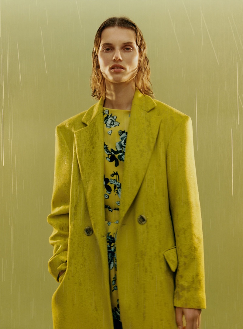 Giedre Dukauskaite wears Zara buttoned menswear coat and floral print dress with tie