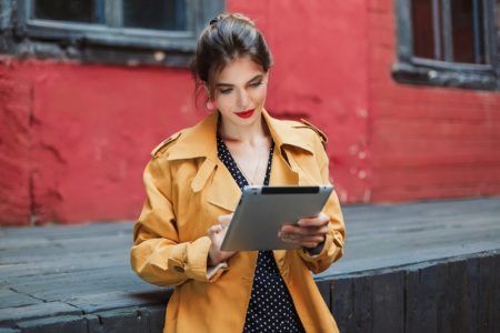 7 Trendy Clothing Websites to Visit Attractive Woman Tablet Trench Coat Polka Dot