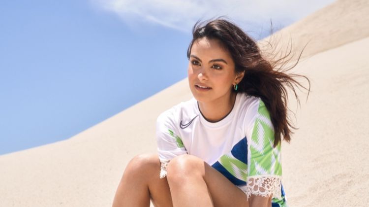 Posing in sand, Camila Mendes wears Koche dress and Argente Vivo earrings