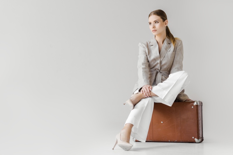 Chic Model Jacket Pants Sitting Suitcase