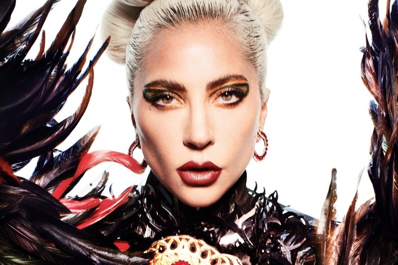 Singer Lady Gaga poses in Aura Tout Vu dress and Chopard earrings
