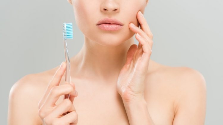 What Are Options For Those With Missing Teeth Woman Toothbrush Closeup Concern