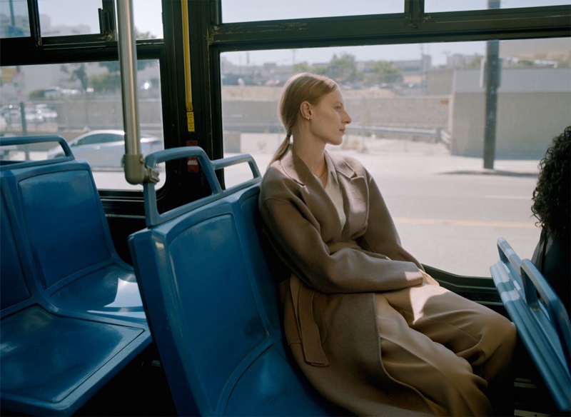 Julia Nobis wears Zara suede coat with belt, white shirt and camel trousers