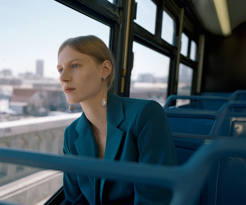 Julia Nobis wears Zara turquoise blazer and diamante earrings