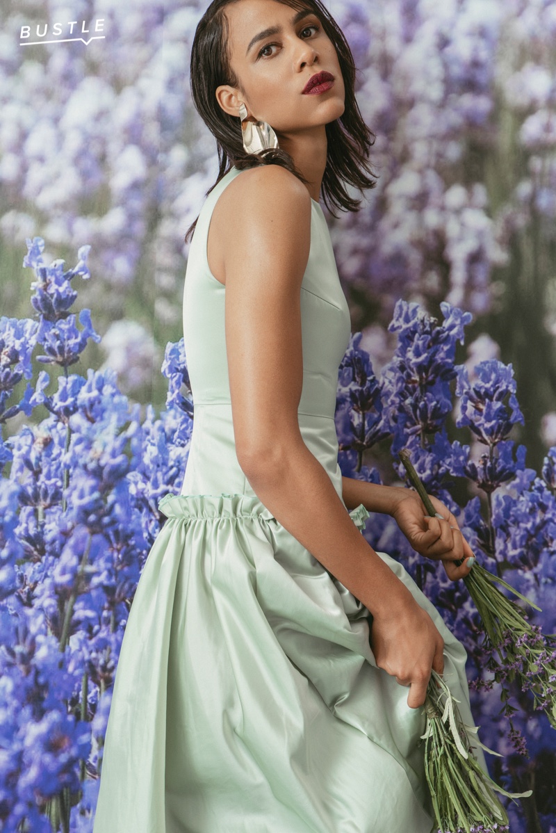 Actress Zawe Ashton poses in Huishan Zhang dress and Faris earrings