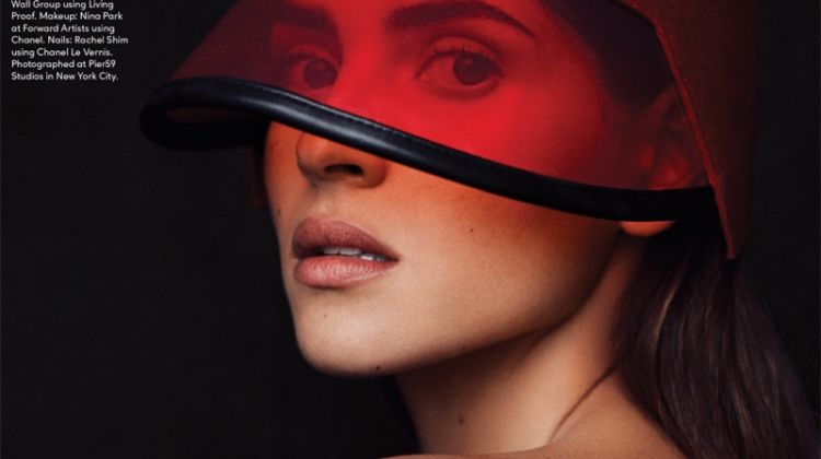 Ready for her closeup, Adria Arjona wears Gucci visor with Cartier rings