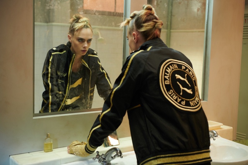 Looking in a mirror, Cara Delevingne fronts PUMA x Balmain campaign