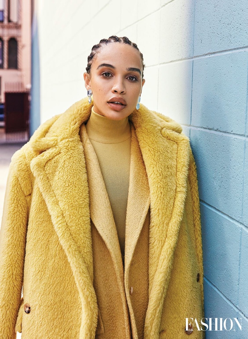 Looking mellow in yellow, Cleopatra Coleman wears Max Mara coat, jacket and turtleneck with Jenny Bird earrings