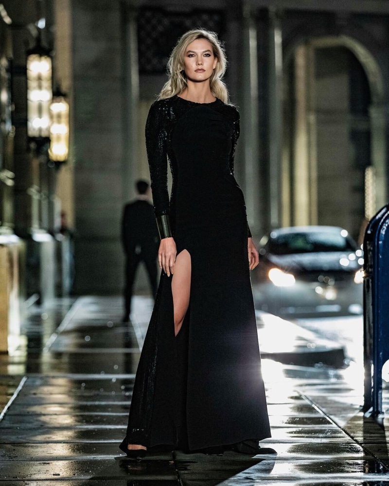 Supermodel Karlie Kloss wears a black gown for Carolina Herrera Bad Boy promotional shots