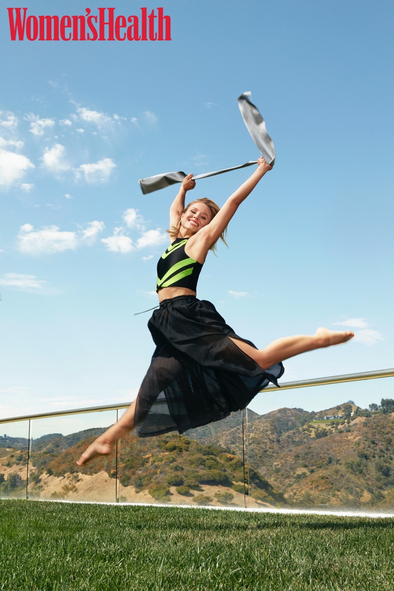 Taking a leap, Kristen Bell wears Koral top and Lucas Hugh skirt