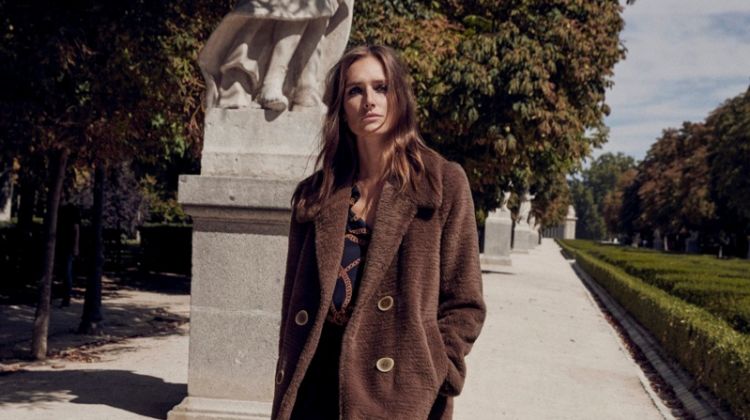 Josephine le Tutour poses in Mango pocketed faux fur coat