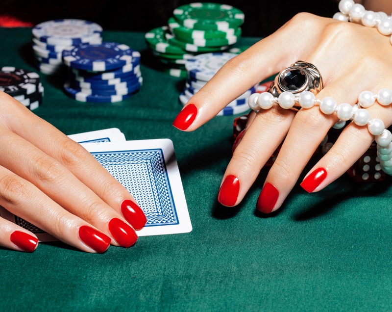 Manicured Red Nails Card Chips Gambling