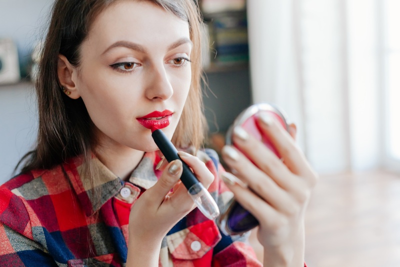 Model Applying Lipstick Looking Compact Mirror