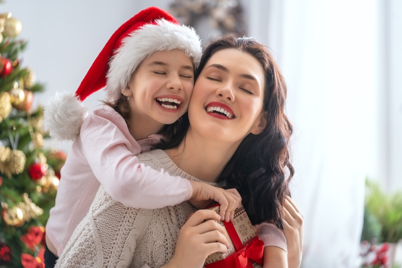 Mother Daughter smiling Christmas Santa Hat