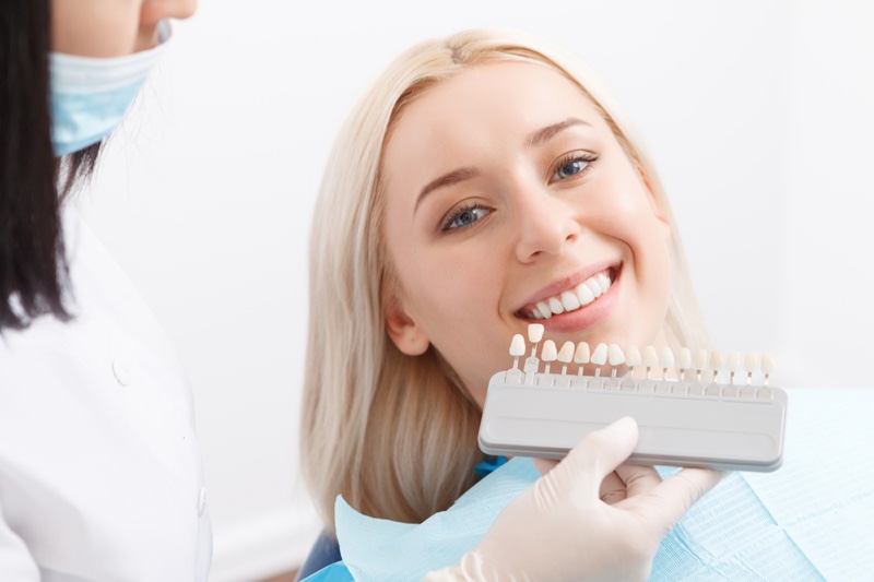 Smiling Woman Teeth Matching Dentist