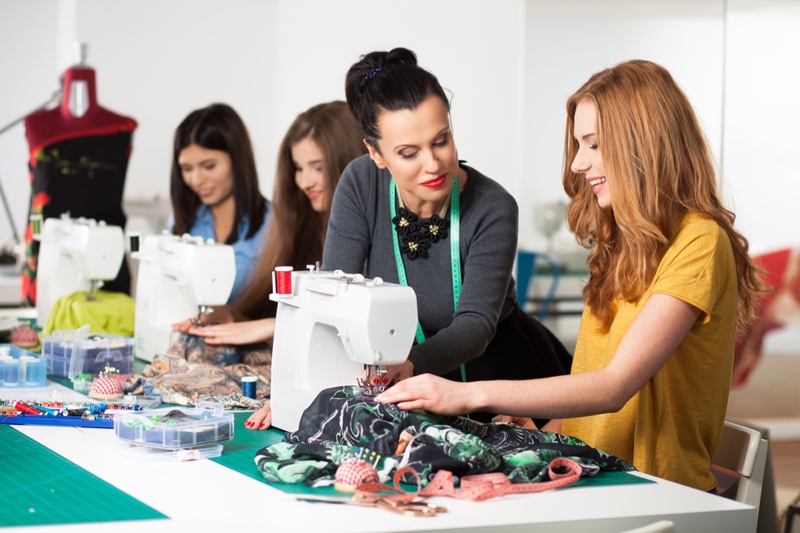 Woman Teaching Sewing Class Students