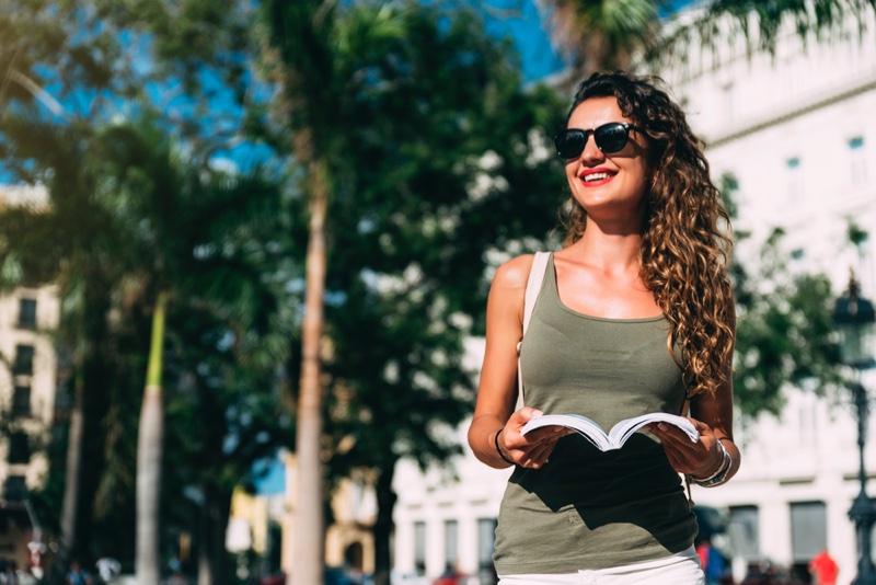 Woman Tourist Stylish Tank Top Sunglasses Smiling