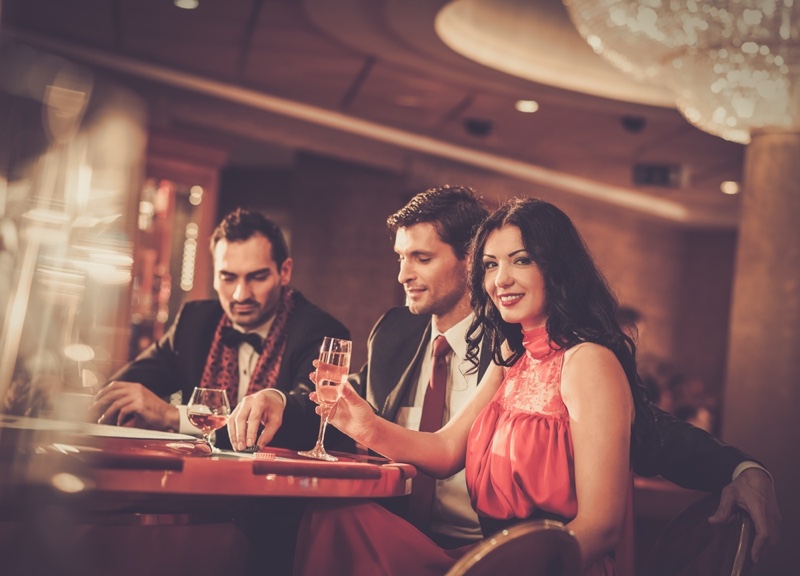 Woman Two Men Casino Table Drinks