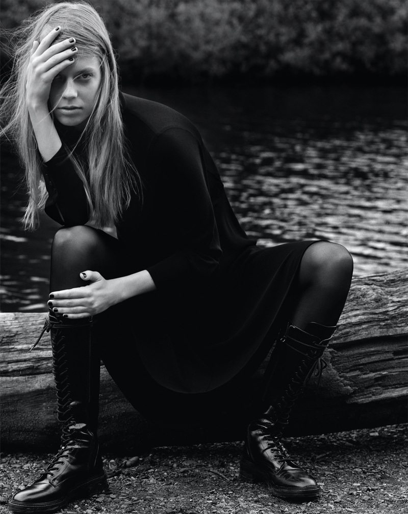 Model Lexi Boling poses in Zara midi dress, opaque tights and low heeled laced boots