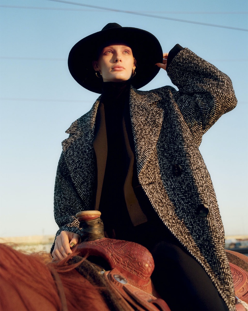 Posing on a horse, Kris Grikaite channels western style for Zara's fall 2019 coat edit