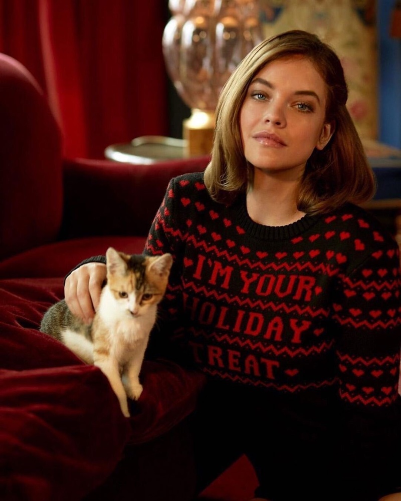 Barbara Palvin poses with a cat for Philosophy di Lorenzo Serafini Holiday Treats sweater campaign