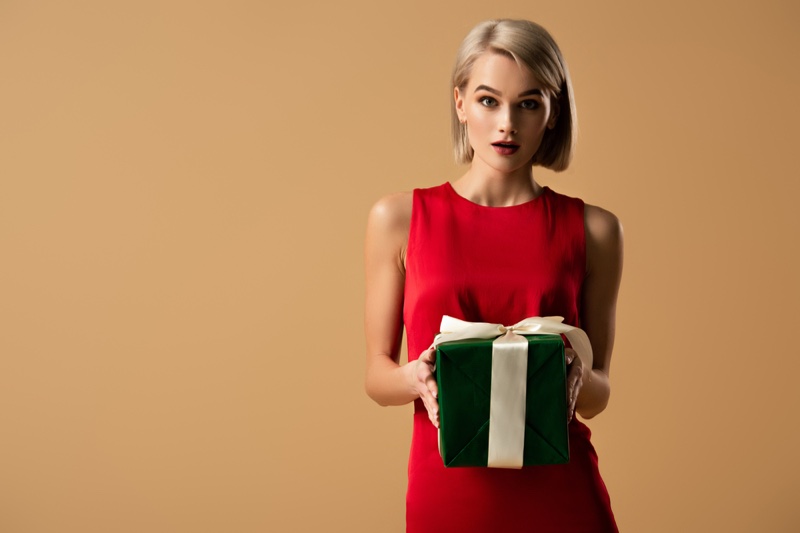 Blonde Holding Gift Box Green Red Dress