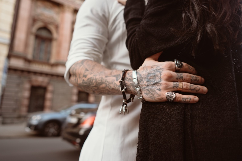 Closeup Man Jewelry Rings Bracelets Holding Women's Waist