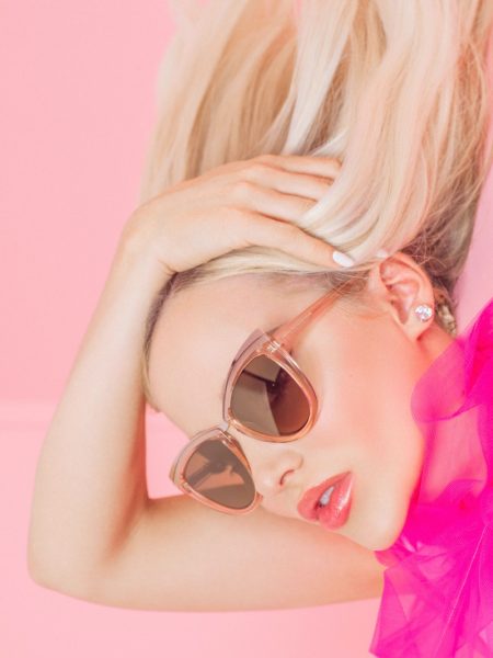 Dove Cameron Looks Pretty in Pink for Prive Revaux Collab