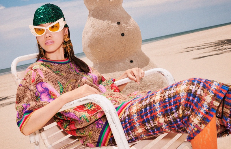 A model poses at the beach for Gucci Holiday 2019 campaign