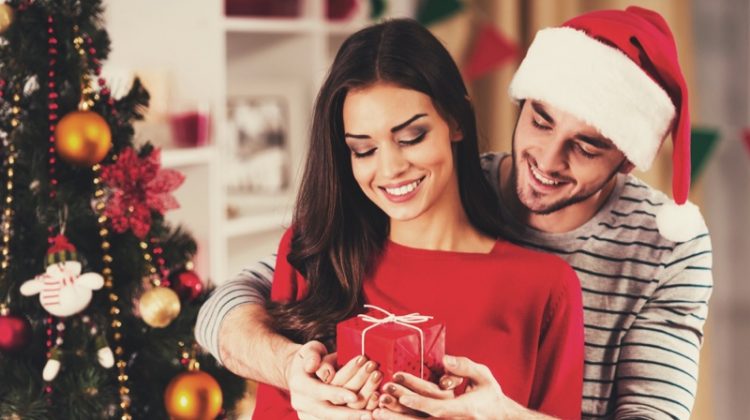 Romantic Holiday Dating Ideas Model Couple Christmas Tree Santa Hat Gift