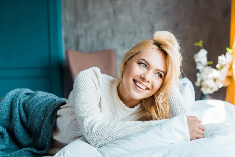 Smiling Woman in Sweater