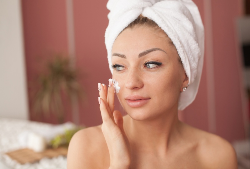 Woman Applying Face Cream