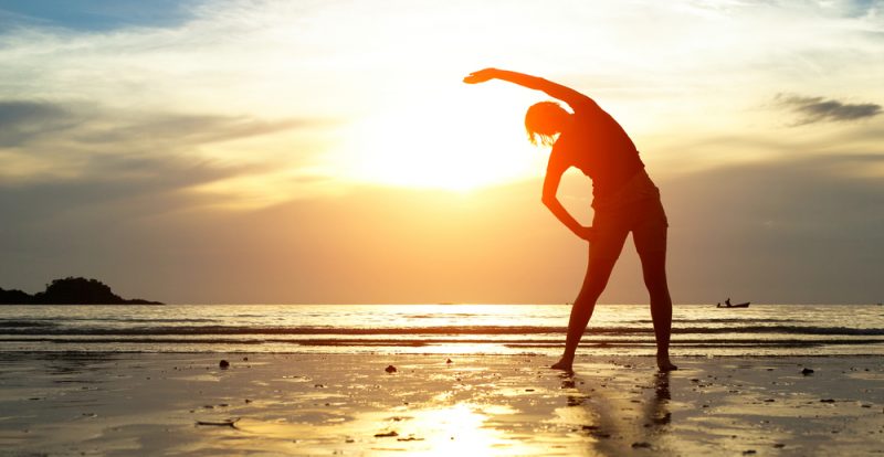 Woman Beach Stretching