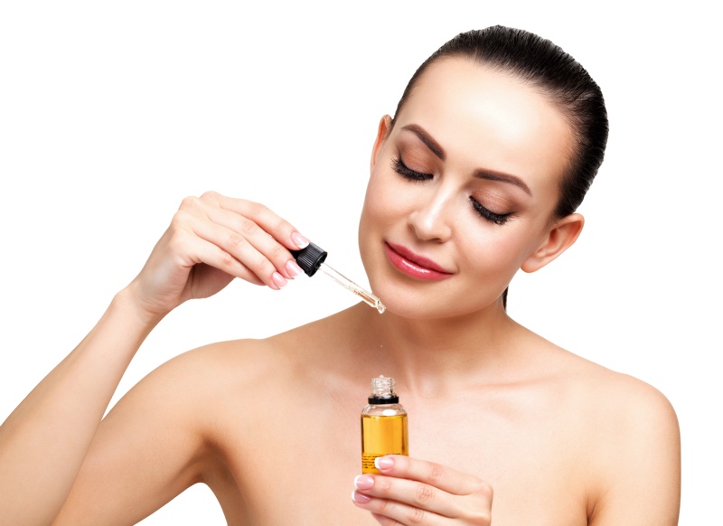 Woman Holding Oil Bottle Beauty