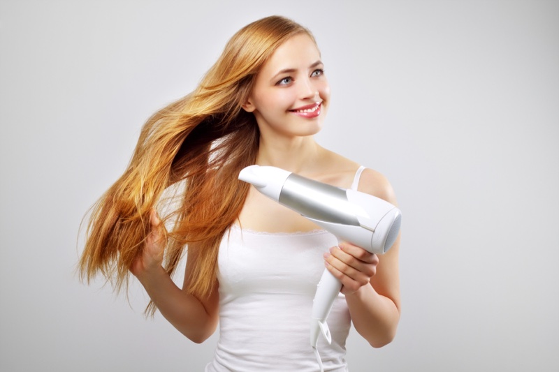 Woman Smiling Hair Dryer