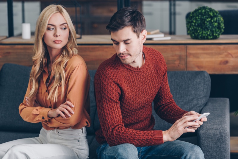 Young Couple Suspicious Woman Man Phone Couch